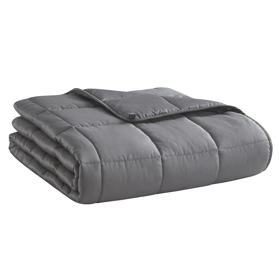 Folded gray weighted blanket on a white background